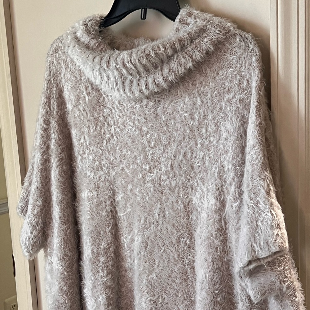 high collar and short sleeve great to wear with a long-sleeved blouse underneath